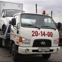 Автоэвакуатор вид на белую кабину